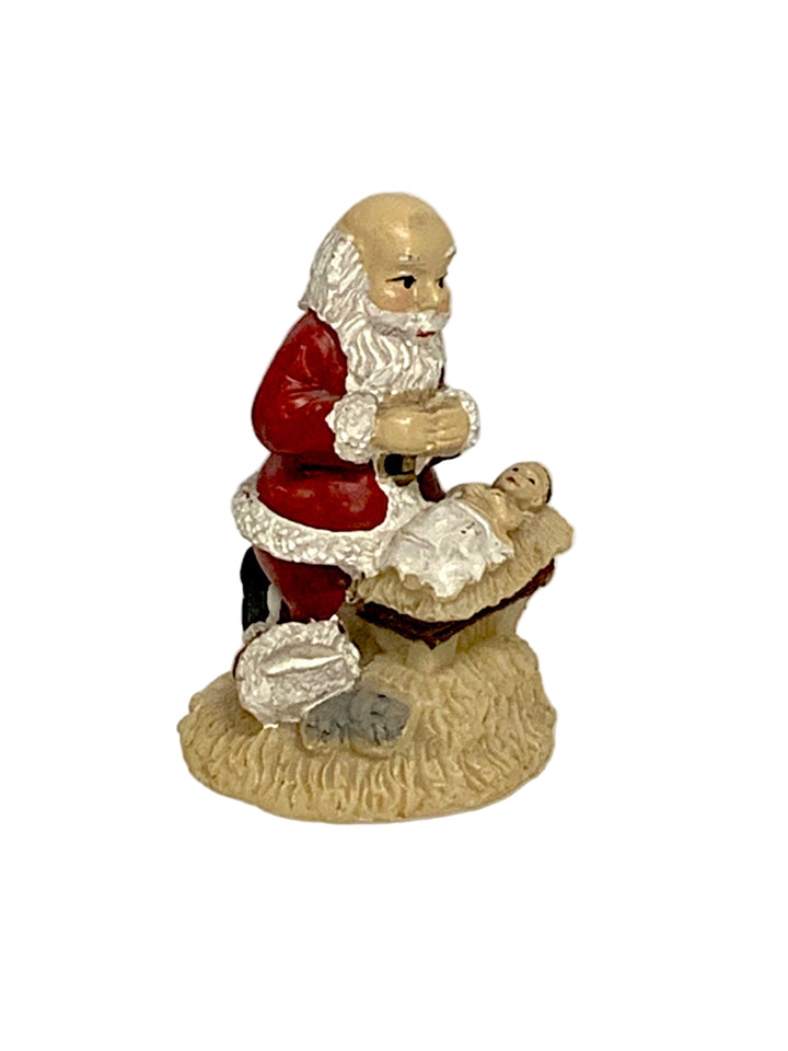 2" Kneeling Santa over Baby Jesus in a Velvet Bag